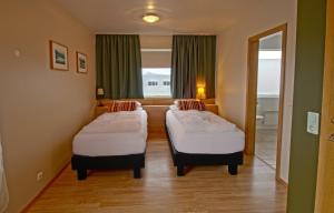 Katil atau katil-katil dalam bilik di Hotel Post