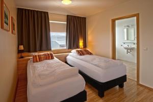 Katil atau katil-katil dalam bilik di Hotel Post
