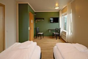 Katil atau katil-katil dalam bilik di Hotel Post