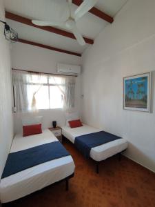 Postel nebo postele na pokoji v ubytování Maison la Casa Créole, spa, emplacement central