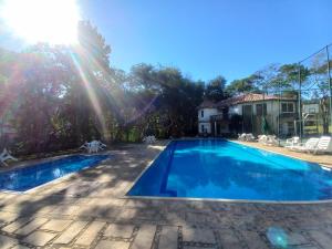 Swimmingpoolen hos eller tæt på Pacote 3 dias Apto Térreo Rock The mointain Itaipava