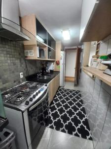 Køkken eller tekøkken på Pacote 3 dias Apto Térreo Rock The mointain Itaipava