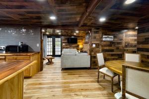 a living room with a table and a couch at Great Little Cabin! in Ruidoso