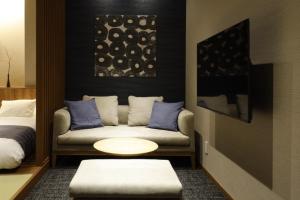 Postel nebo postele na pokoji v ubytování Hotel A'bant Shizuoka