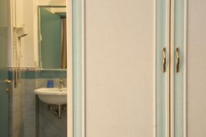a bathroom with a sink and a mirror at Oasi in Maiori +19 photos