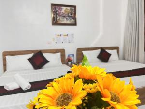 Postel nebo postele na pokoji v ubytování Fortuna Homestay