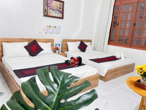Postel nebo postele na pokoji v ubytování Fortuna Homestay
