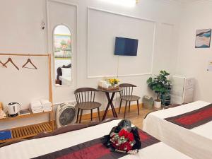 Postel nebo postele na pokoji v ubytování Fortuna Homestay