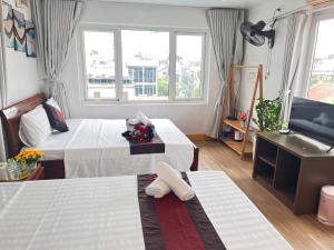 Postel nebo postele na pokoji v ubytování Fortuna Homestay