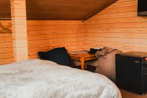 Postel nebo postele na pokoji v ubytování Hakuba Pension & Log Hotel Meteor