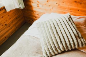 Postel nebo postele na pokoji v ubytování Hakuba Pension & Log Hotel Meteor