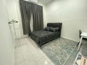 a black couch in a room with a window at Homestay Bronizam 2 in Nilai