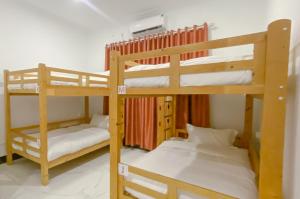 Cama o camas de una habitación en Easy Backpackers Paradise