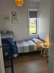 Postel nebo postele na pokoji v ubytování Beach Hut Scamander
