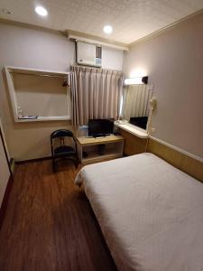 Postel nebo postele na pokoji v ubytování Long Cherng Hotel
