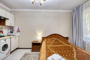 Ένα ή περισσότερα κρεβάτια σε δωμάτιο στο Апартаменты студия Коктем-1, 26
