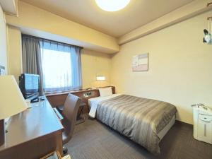 Postel nebo postele na pokoji v ubytování Hotel Route-Inn Ueda -Kokudou 18 Gou-