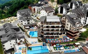 an aerial view of a resort with a pool and buildings at Apartman Viva Milmari in Kopaonik