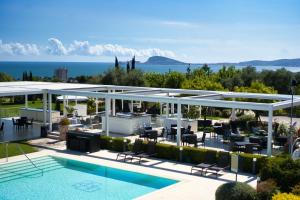 a view of the pool and patio of a villa at Kora Park Resort in Formia
