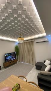 Posezení v ubytování Al Reef Apartment