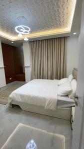 Postel nebo postele na pokoji v ubytování Al Reef Apartment