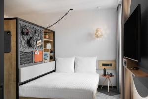 Stay KooooK Leipzig City - Online Check In客房内的一张或多张床位