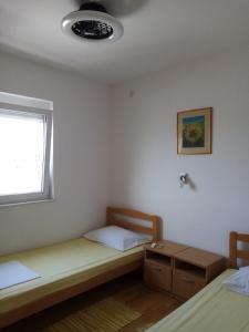 Postel nebo postele na pokoji v ubytování APARTMAN ZVONIMIR