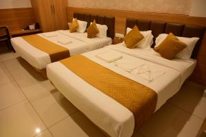 Postel nebo postele na pokoji v ubytování Bimba Hotels + 9 fotografií