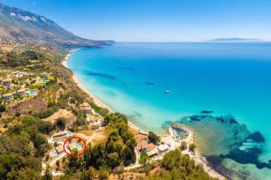 an aerial view of a beach with a red map at Villa Gerasmia in Trapezaki