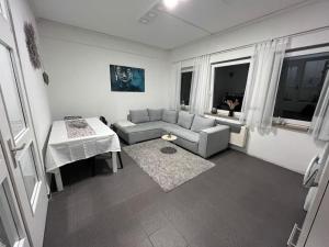 a living room with a couch and a table at Zentrale Wohnung in Ostrach in Ostrach