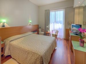 Postel nebo postele na pokoji v ubytování SenB Hotel