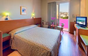 Postel nebo postele na pokoji v ubytování SenB Hotel