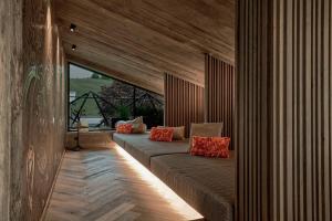 A bed or beds in a room at die HOCHKÖNIGIN - Mountain Resort