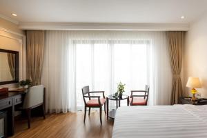 Postel nebo postele na pokoji v ubytování Hotel De La Seine