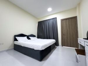 Postel nebo postele na pokoji v ubytování Baraha Star Residence