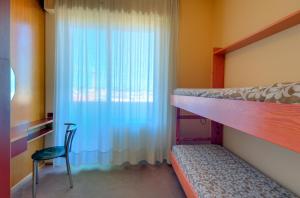 Postel nebo postele na pokoji v ubytování SenB Hotel