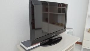 A television and/or entertainment centre at Piso de Ana Piso en Carnota con espacio exterior