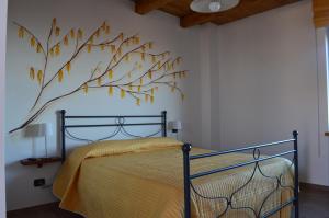 Ein Bett oder Betten in einem Zimmer der Unterkunft Agriturismo Ra Nissora