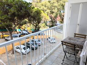 a balcony with cars parked in a parking lot at IslaOC Apartamentos - Apartamento con Acceso Privado a Playa in Isla Cristina