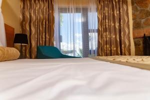 Letto o letti in una camera di Sunbird Ku Chawe