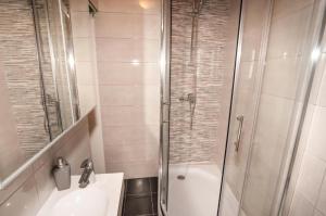a bathroom with a shower and a sink and a toilet at Ellena Sunshine in Opatija +53 photos