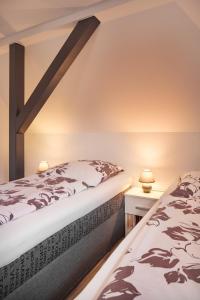 Postel nebo postele na pokoji v ubytování Ferienwohnung Leipzig Süd