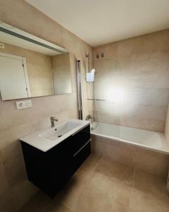 a bathroom with a sink and a bath tub at Villa Axarquia paraiso 88 Sinese Design Homes in Viñuela