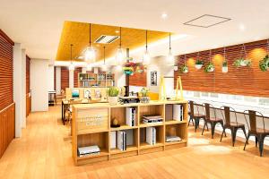 a kitchen and dining room with a table and chairs at Comfort Hotel Tokyo Kanda in Tokyo