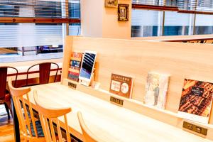 a dining room with a table and chairs at Comfort Hotel Tokyo Kanda in Tokyo