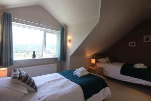 Postel nebo postele na pokoji v ubytování Hilltop, Coniston spacious bungalow with incredible views