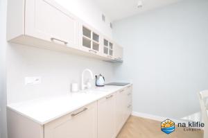Kuchyň nebo kuchyňský kout v ubytování Apartament na klifie - Łukęcin