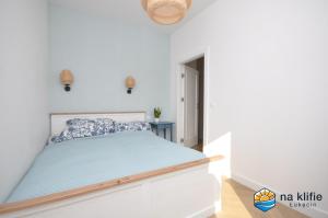 Postel nebo postele na pokoji v ubytování Apartament na klifie - Łukęcin