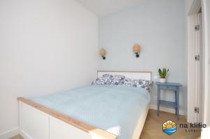 Postel nebo postele na pokoji v ubytování Apartament na klifie - Łukęcin