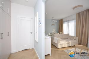 Postel nebo postele na pokoji v ubytování Apartament na klifie - Łukęcin